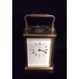 ANGELUS, SWISS, A 20TH CENTURY GILT BRONZE CARRIAGE CLOCK With carry handle and oval glass revealing