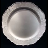 A LARGE 18TH CENTURY ENGLISH CREAMWARE POTTERY CHARGER Silver shape with a scalloped edge, moulded