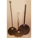 A COLLECTION OF THREE 18TH CENTURY AND LATER BRASS AND CAST IRON CHESTNUT ROASTERS Concave