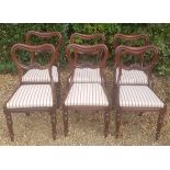 A SET OF SIX VICTORIAN MAHOGANY SADDLE BACK DINING CHAIRS With carved rail over red and white