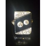 AN ART DECO 18CT WHITE GOLD, ONYX AND DIAMOND DRESS RING The rectangular bezel with a central
