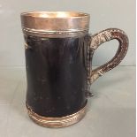 A 17TH/18TH CENTURY TANKARD FORM BLACK JACK The tapering body with silver interior lining, as well