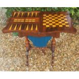 A VICTORIAN ROSEWOOD GAMES TABLE With serpentine shaped fold over top opening to reveal satinwood