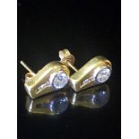A PAIR OF HIGH CARAT BICOLOUR GOLD AND DIAMOND EARRINGS Solid gold drop form studs inset witha