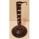 AN 18TH CENTURY SPIRAL STEEL CANDLESTICK On fruitwood base, engraved 'L.N.A.8c LM'. (20cm)