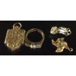 A LATE VICTORIAN 9CT GOLD SHIELD SHAPED LOCKET Together with a single 9ct gold clip earring, a