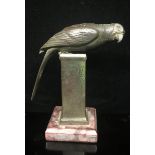 REITER MÜNCHEN, AN EARLY 20TH CENTURY BRONZE STATUE A parrot perched on a pedestal, supported on a
