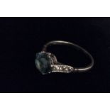 AN EARLY 20TH CENTURY PLATINUM, TOPAZ AND DIAMOND DRESS RING The circular cut bright blue and old