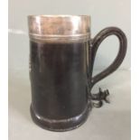 A 17TH/18TH CENTURY LEATHER TANKARD FORM BLACK JACK With lined silver lined interior and rim, the