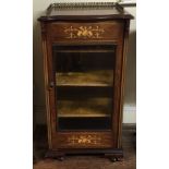 A LATE VICTORIAN ROSEWOOD AND FLORAL MARQUETRY INLAID MUSIC CABINET With brass gallery above a