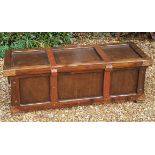 A 20TH CENTURY PINE COFFER With a panelled top and sides, with beaten copper corner brackets. (139cm