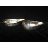TWO 18TH CENTURY ENGLISH SILVER INVALID FEEDING CUPS Of elliptical shape, with wide pourer and