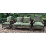 AN EARLY 20TH CENTURY FIGURED WALNUT BERGÈRE SUITE Comprising a two seater settee and two armchairs,