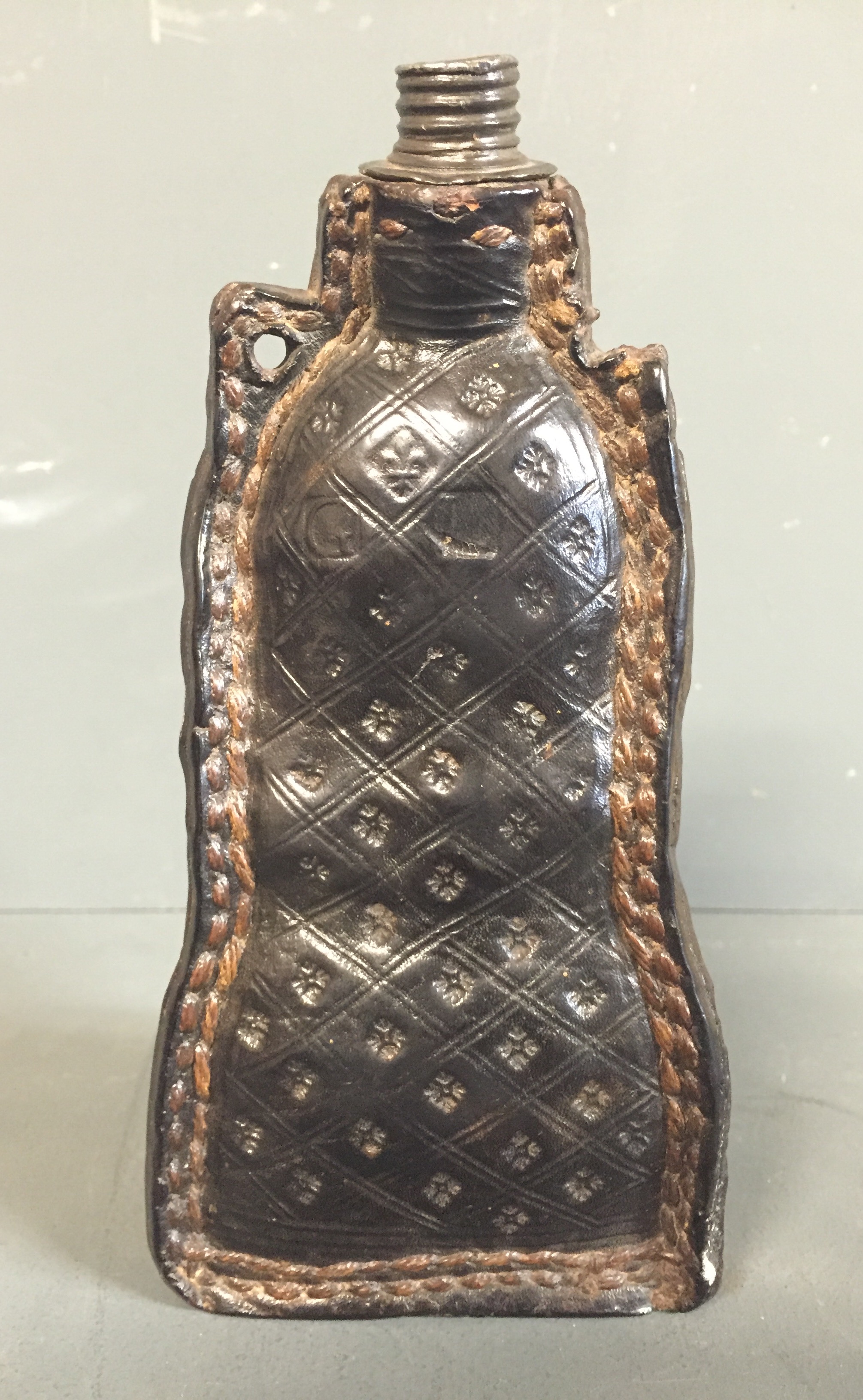 A 17TH CENTURY LEATHER RESTORATION BOTTLE Perforated lugs over red and white painted body molded - Image 2 of 4