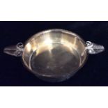 CESAR, AN EARLY 20TH CENTURY DANISH SILVER CIRCULAR DISH With two handles cast as stylized leaves,