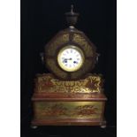 A REGENCY PERIOD MAHOGANY AND BRASS INLAID MANTLE CLOCK Decorated in the classical style with