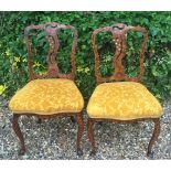 A PAIR OF 18TH CENTURY DUTCH HALL CHAIRS Marquetry inlaid with birds, flowers and bone florets, with