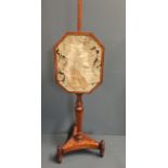 A REGENCY SATINWOOD AND MAHOGANY POLE SCREEN The woven pictorial panel, lady in a period dress. (