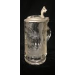 AN EARLY 20TH CENTURY ACID ETCHED QUART GLASS TANKARD Decorated with a running deer in a forest