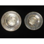 TWO ENGLISH HALLMARKED SILVER SHALLOW DISHES The centres embossed with an English rose. (d 13.5cm