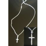 AN 18CT WHITE GOLD AND DIAMOND CROSS PENDANT The white gold cross claw set throughout with round cut