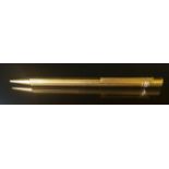 CARTIER, AN 18CT GOLD PLATED MUST DE CARTIER GODRON PATTERN RETRACTABLE BALLPOINT PEN Having a