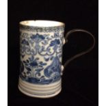 AN 18TH CENTURY CHINESE BLUE AND WHITE PORCELAIN TANKARD Hand painted with Buddhist symbols, above a