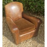 AN EARLY 20TH CENTURY CLUB ARMCHAIR Upholstered in tan leather and complete with loose velvet