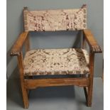 A 19TH CENTURY SPANISH WALNUT OPEN ARMCHAIR With upholstered seat, back and carved overscroll