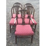 A SET OF FIVE 19TH CENTURY MAHOGANY DINING CHAIRS Including one carver, the pierced back rails