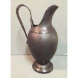 A 17TH/18TH CENTURY LEATHER JUG Of classical form, the organic metal handle with moulded rosette