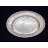 JUST ANDERSEN, DANISH, 1884 - 1943, A PEWTER PLATE Of simple design, with raised outer rim and