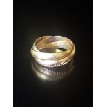 CARTIER, LES MUST DE CARTIER, AN 18CT THREE COLOUR GOLD TRINITY RING Signed 'Les Must de Cartier'