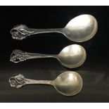 A COLLECTION OF THREE EARLY 20TH CENTURY SILVER SERVING SPOONS Along with a Danish silver salver,