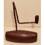 AN 18TH CENTURY IRON TABLE RUSHLIGHT AND CANDLE SOCKET With spiral twist stem and extended bracket