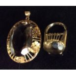 TWO 14CT GOLD AND SMOKY QUARTZ JEWELLERY ITEMS To include a large pendant with oval cut stone on a