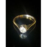 AN 18CT GOLD AND DIAMOND SOLITAIRE RING The brilliant cut diamond illusion set in white gold to a