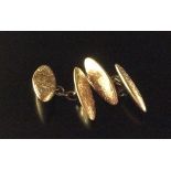 A PAIR OF EDWARDIAN HALLMARKED 9CT ROSE GOLD CUFFLINKS The marquise shaped plaques of rose gold,