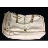 JIMMY CHOO, A SOFT CREAM LEATHER SLOUCH HANDBAG With tan suede interior and gold tone chain