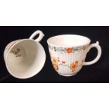 ROYAL WORCESTER, TWO PORCELAIN COFFEE CUPS Of fluted form, colour enamelled with a Kakiemon design