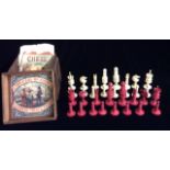 A LATE 19TH/EARLY 20TH CENTURY IVORY CHESS SET Thirty two turned pieces in natural and red stained