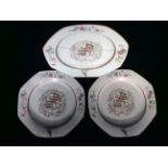 A SET OF THREE 18TH CENTURY CHINESE PORCELAIN ARMORIAL PLATES The rim painted with an eagle