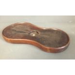 AN 18TH CENTURY OAK KIDNEY SHAPED COASTER