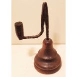 AN 18TH CENTURY IRON TABLE RUSHLIGHT AND CANDLE SOCKET The short stem and bracket arm, with spiral