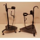 AN 18TH CENTURY IRON TABLE RUSHLIGHT HOLDER AND CANDLE SOCKET The spring grip and spiral twist stem,