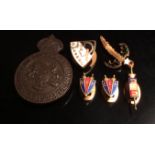 A COLLECTION OF EARLY 20TH CENTURY ENAMEL BADGES 'FFE' held within a black shield with sword, a pair