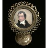 AN EARLY 19TH CENTURY MINIATURE PORTRAIT Of a gentleman, contained in a later gilt metal starburst
