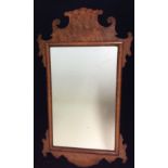 A GEORGIAN STYLE BURR WALNUT RECTANGULAR PIER MIRROR Topped with a scrolled finial, along with a