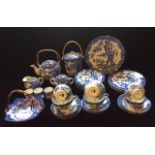 AN EARLY 20TH CENTURY JAPANESE PORCELAIN BLUE AND WHITE TEA SERVICE To include six cups and saucers,