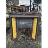 A VICTORIAN CAST IRON FIRE PLACE Inset with an Adams design tile on a yellow ground, no grate. (91.